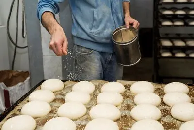 Male worker in a bread factory
