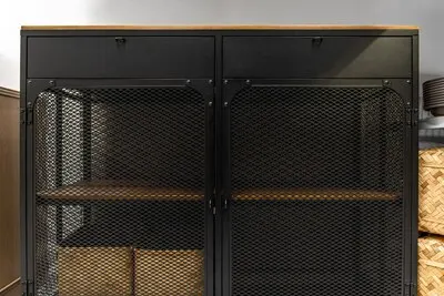 Black metal cabinet with mesh doors and wood top loft storage
