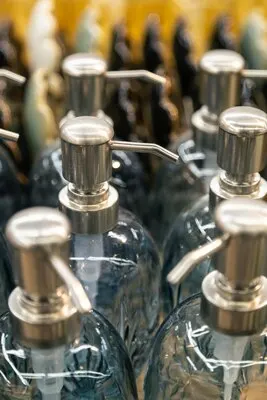 Containers for liquid soap or shampoo with a dispenser is sold in a supermarket