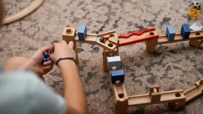 Boy playing with his toys indoors