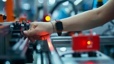 A closeup of a hand with a red smartwatch programming a hightech machine in a factory