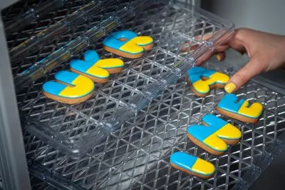 The process of making gingerbread in the form of the word ukraine