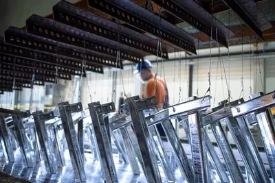 Metal parts being treated with zinc coating